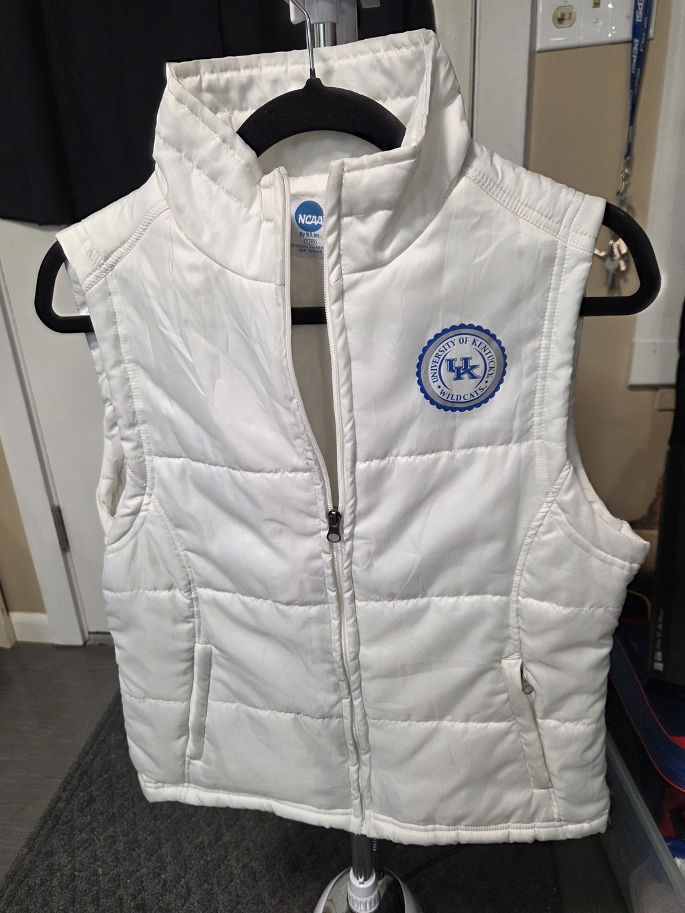 NCAA White Quilted Sleeveless Puffer Vest with Blue Logo
